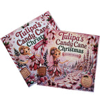 Two copies of the 'Tulipa's Candy Cane Christmas Storybook' resting on a light wood surface. The book cover features a whimsical illustration of a fairy in a candy cane dress in a snowy castle landscape, with candy canes, berries, and the title in large decorative lettering.