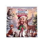 A children's hardcover storybook titled 'Tulipa's Snowy Christmas Storybook' featuring a colorful winter illustration with a fairy, deer, fox, rabbit, squirrel, hedgehog, and owl in a snowy forest, displayed on a light wood surface.
